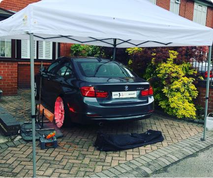 bmw alloy wheel being repaired using SMART repair and a heat lamp